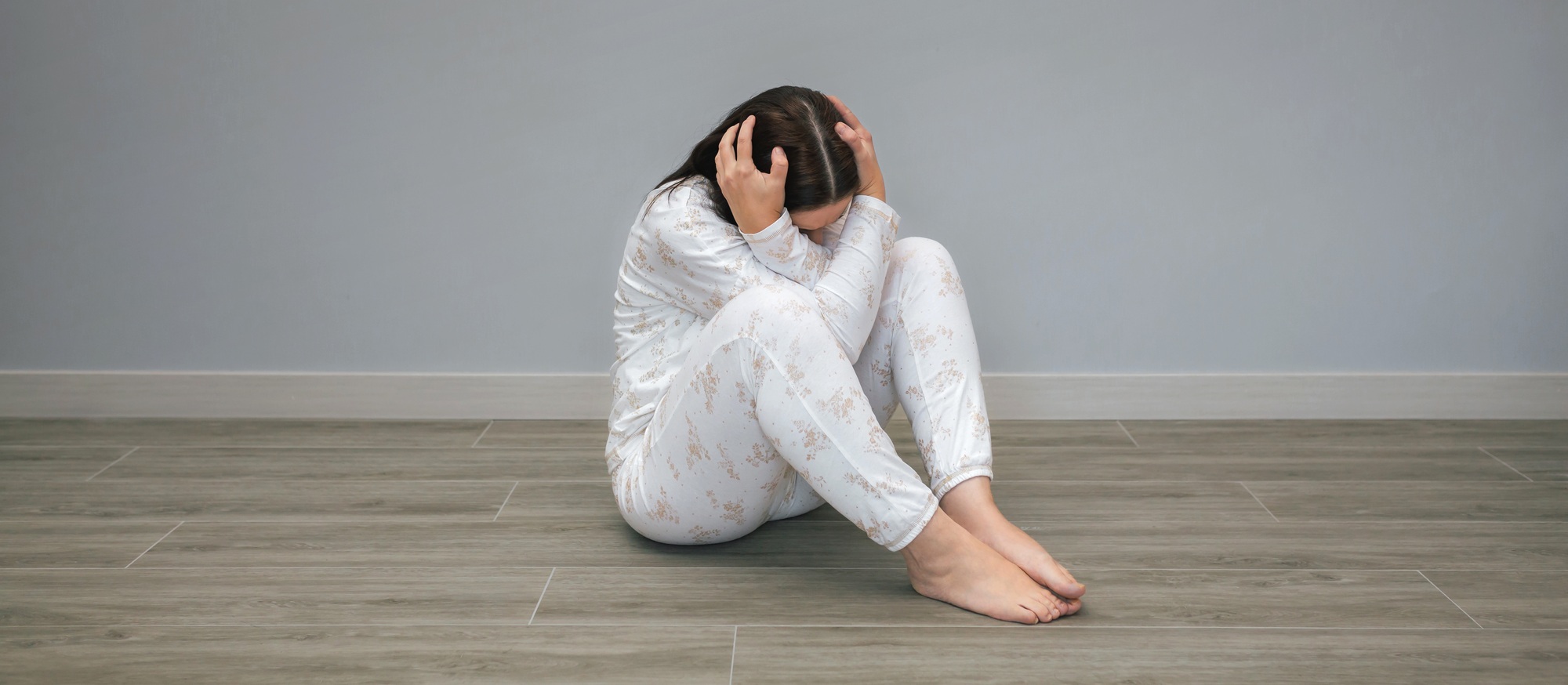 Unrecognizable woman with mental disorder and suicidal thoughts