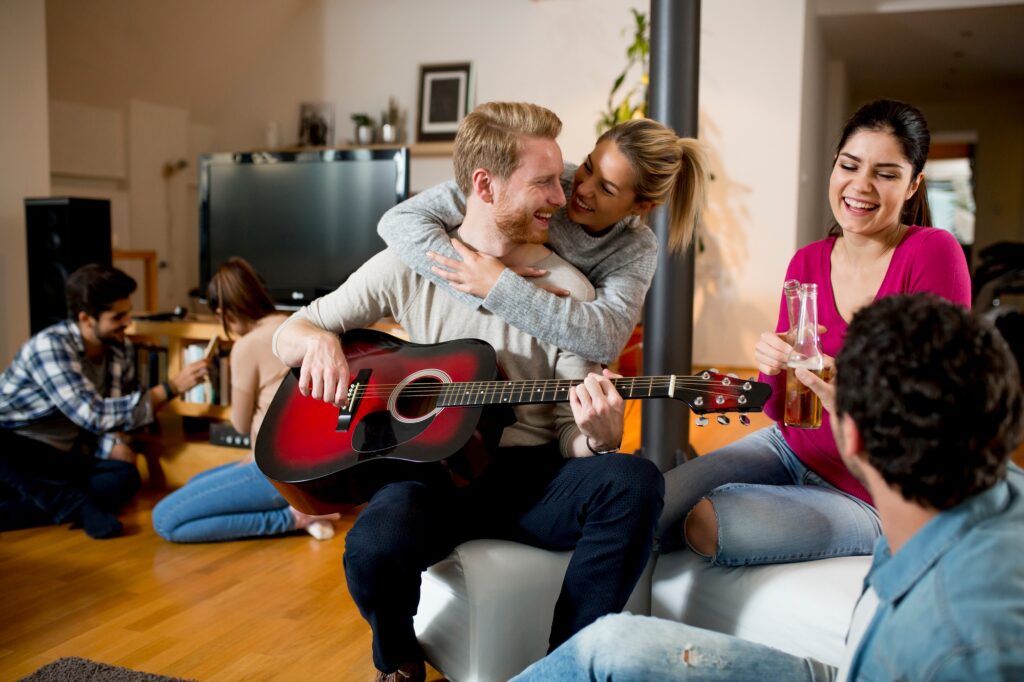 Friends having fun with guitar